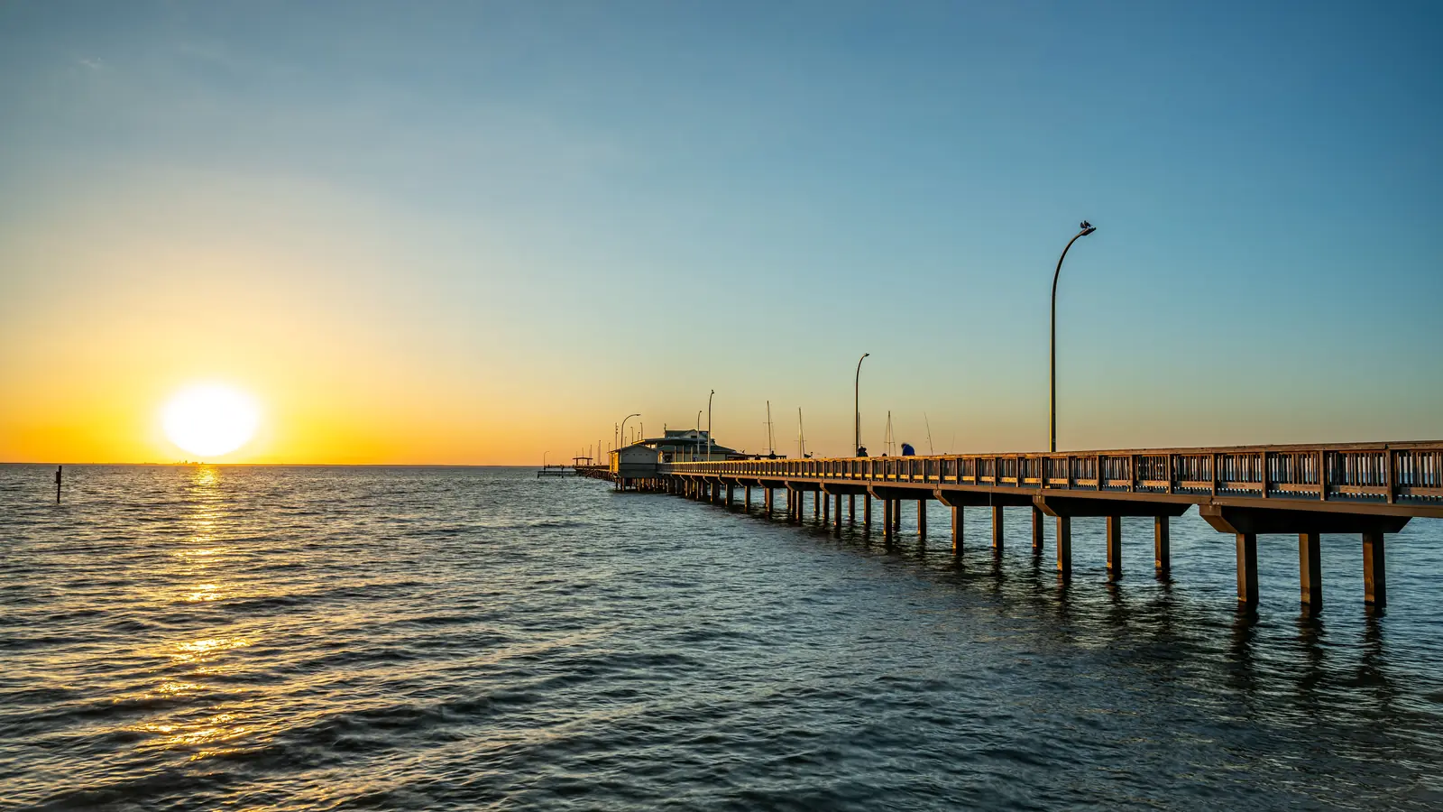 Sunset over Mobile Bay at the Fairhope pier in Alabama