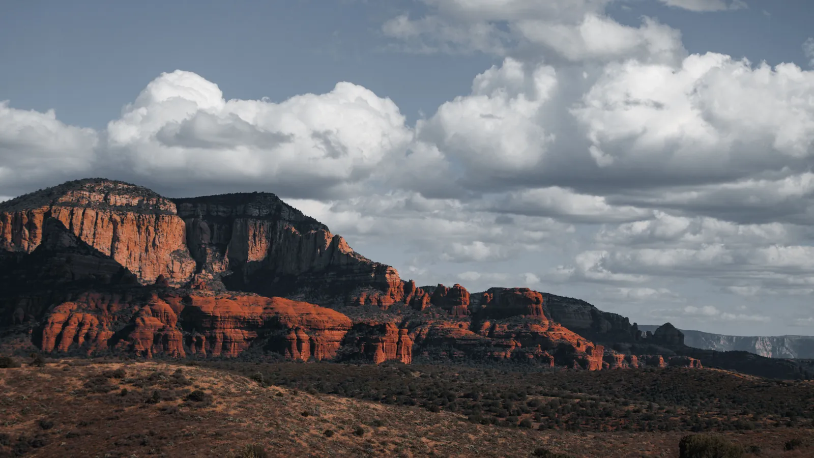 Red rock formations near Sedona, Arizona, under a dramatic sky